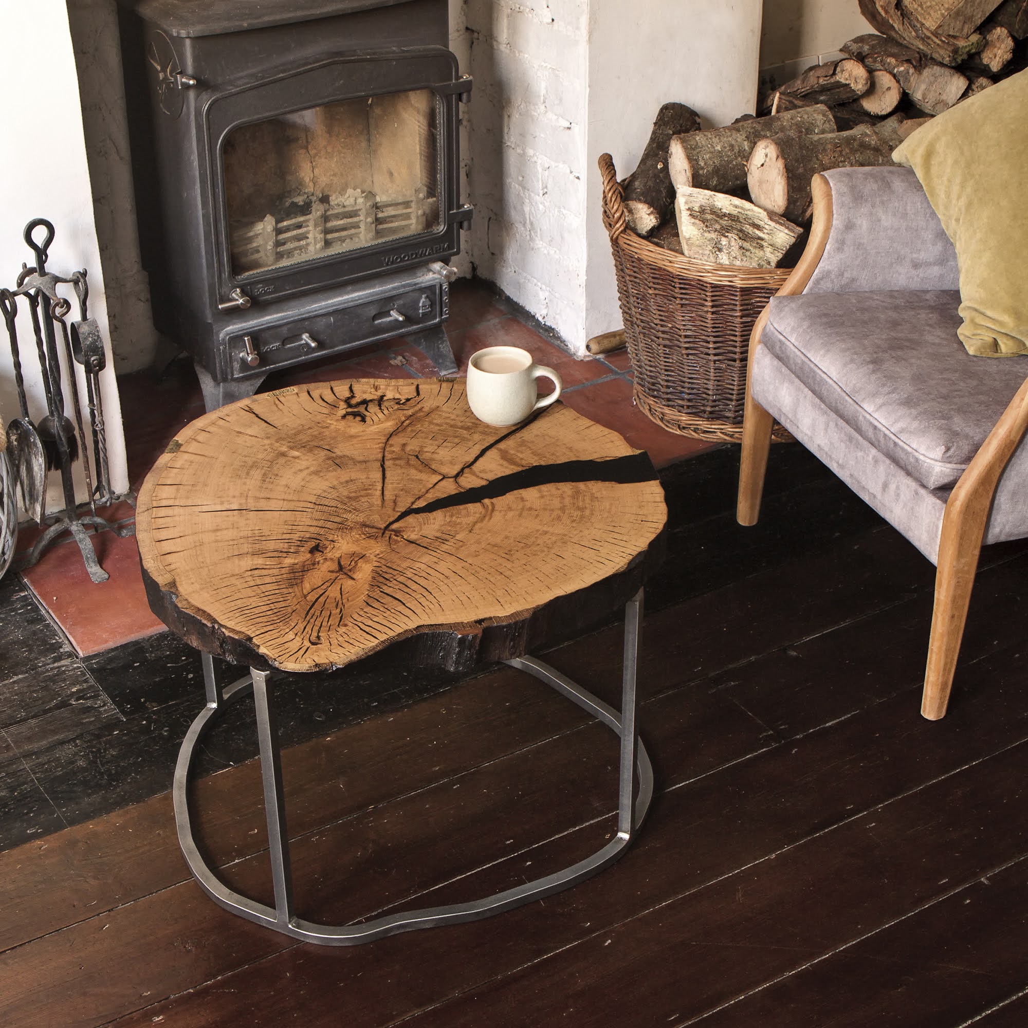Stable weathered oak organic slice trunk side table by the fireplace