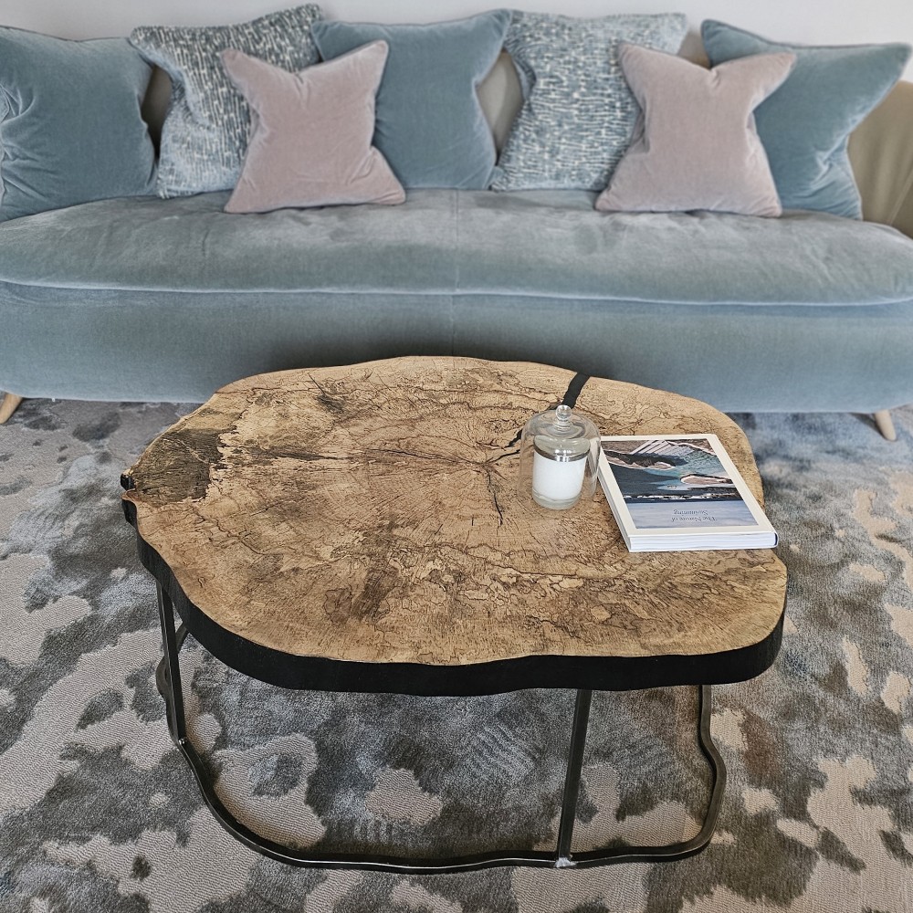 Latmore spalted beech slice tree trunk coffee table a slice from spalted beech tree that fell in a storm handemade into a bespoke luxury coffee table centre piece for a living room or commercial space. handforged metal frame follows the natural organic curves of the table top.